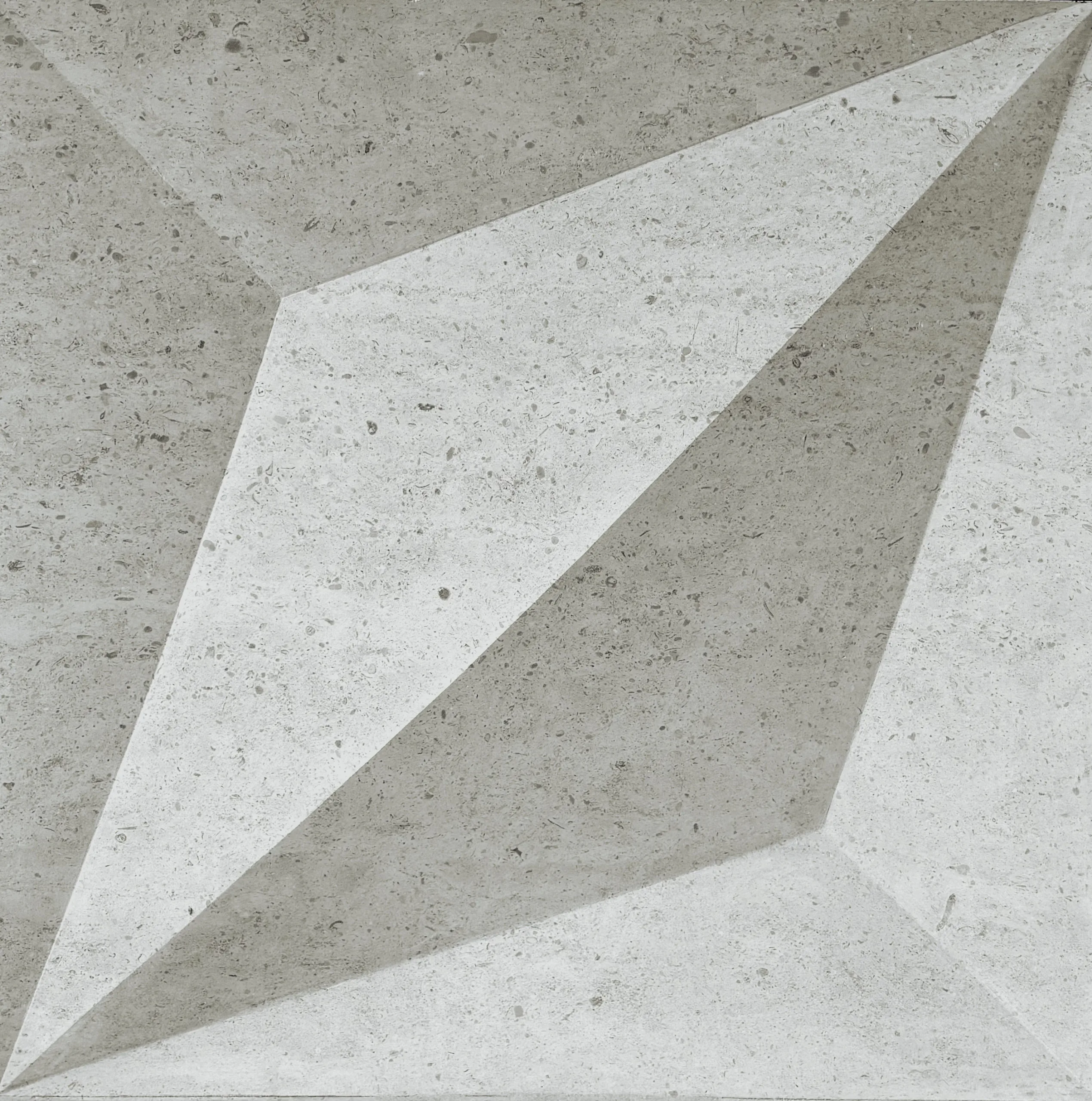 A cast concrete relief, a faceted diamond catching the light